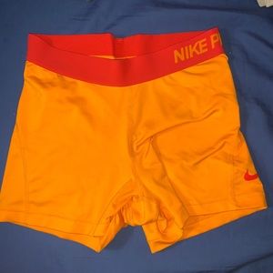 Orange & red Nike pros